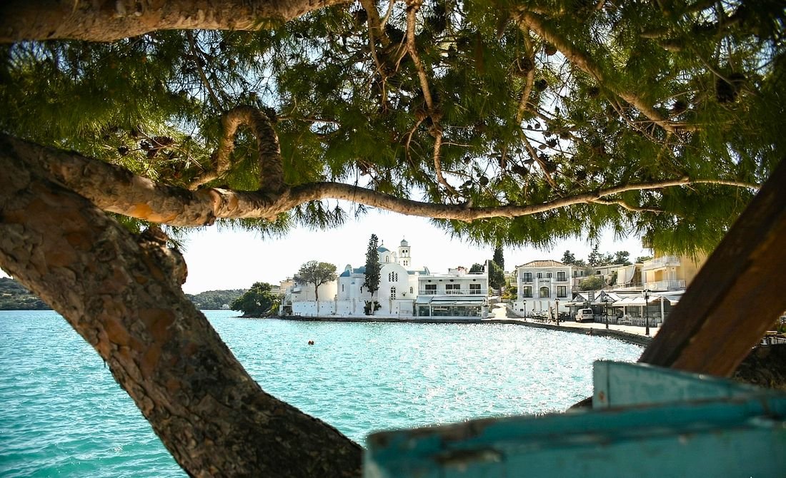 The waterfront church at Porto Heli, seen through a pine